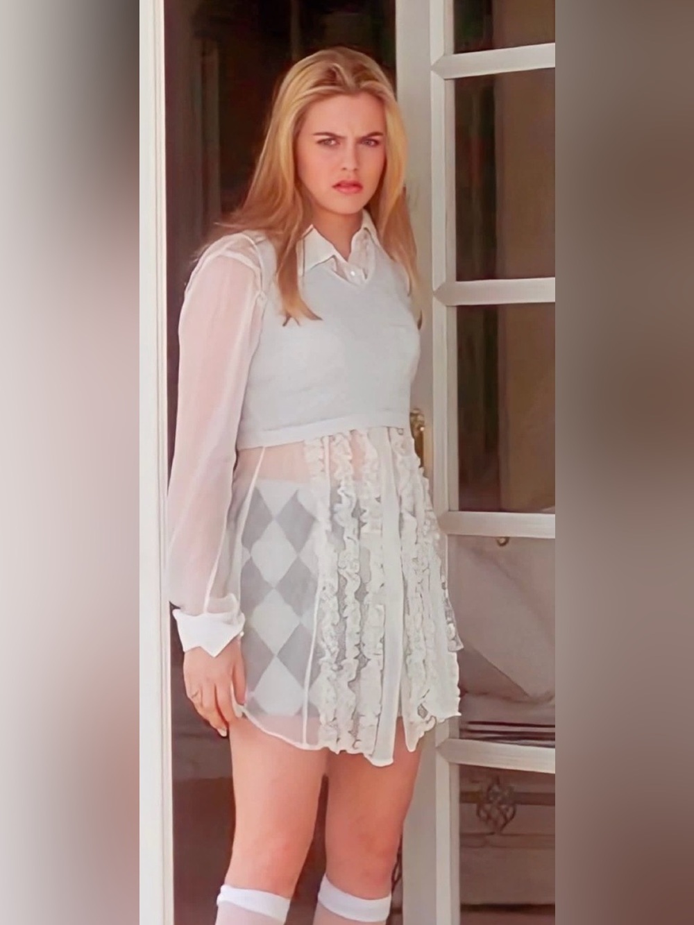Sheer top, just like the one from clueless. Large, but can fit medium & small!